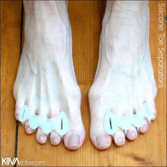 Silicone toe separators worn on bare feet
