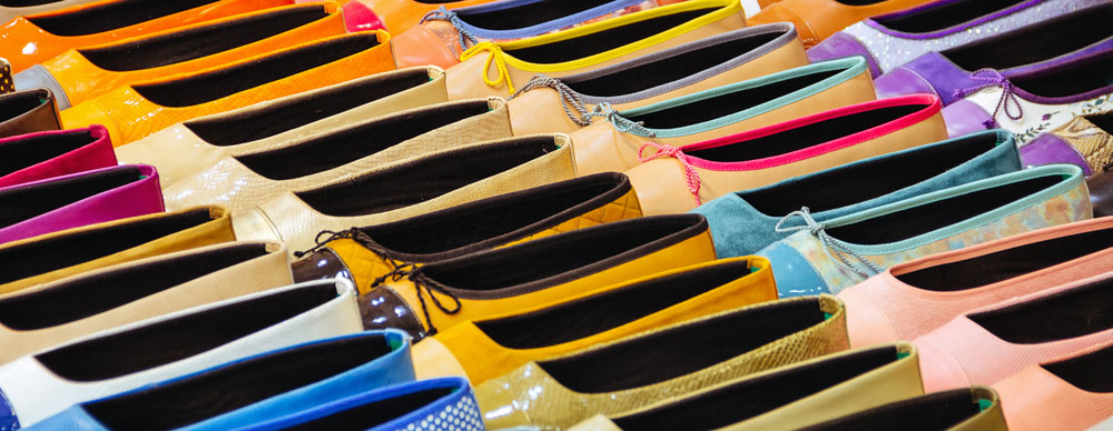 photo of rows of pretty colourful ballet flats