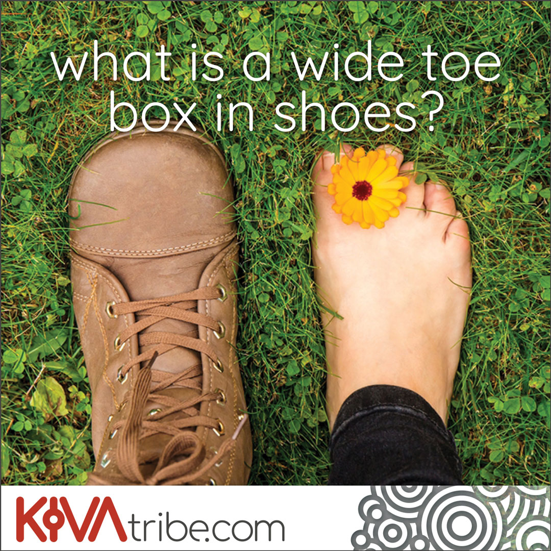 A pair of feet one wearing a wide toe box barefoot boot the other bare with a flower between the toes with the words "what is a wide toe box in shoes"